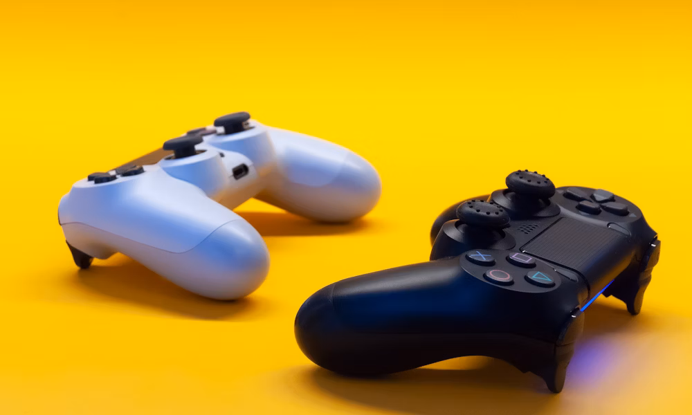 Game controllers on yellow background
