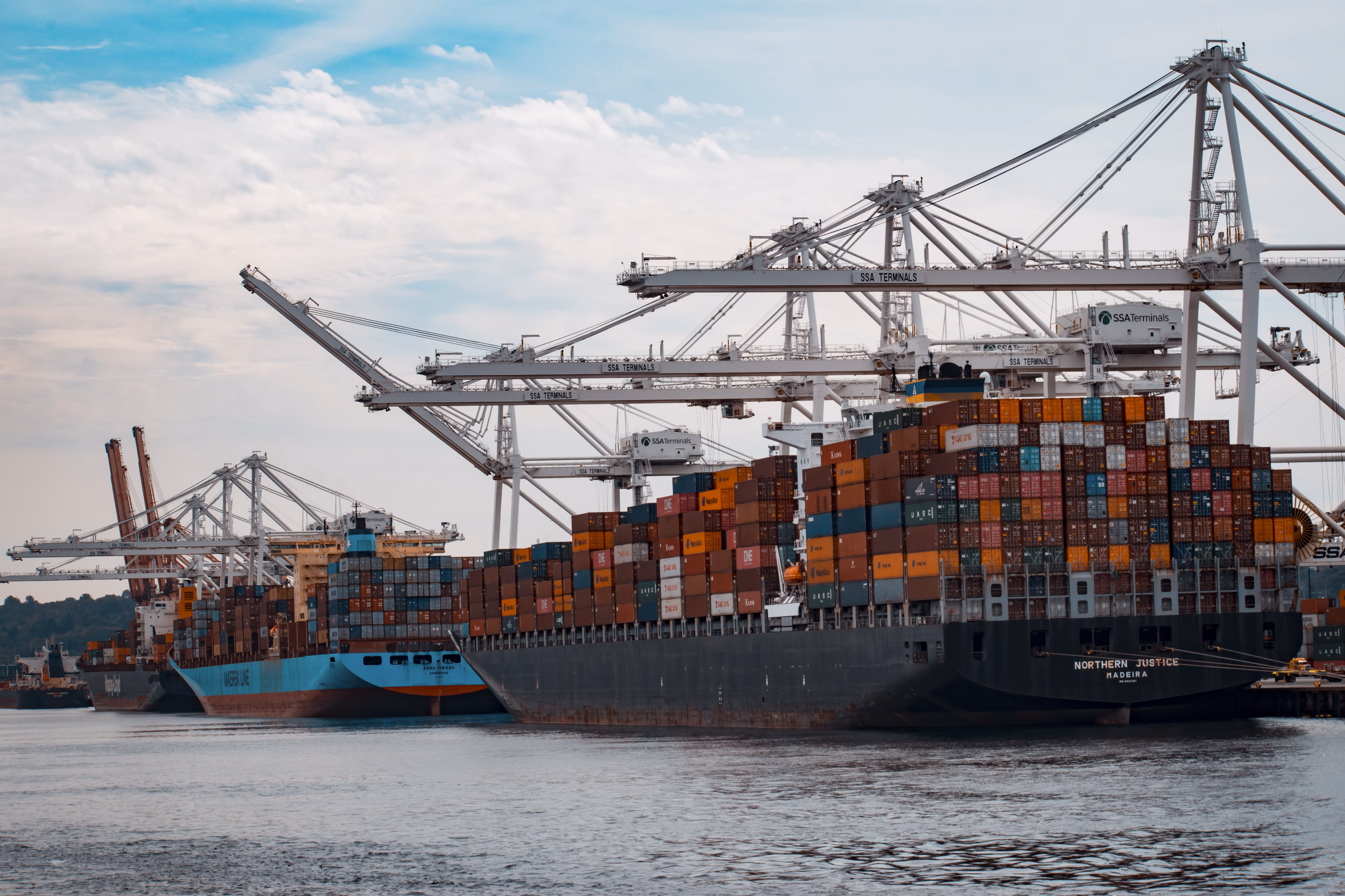 Container ship at port terminal